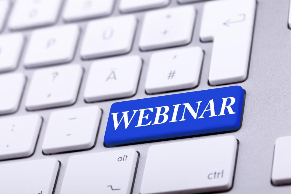 White keypad with blue key with the word ‘WEBINAR’.