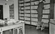 Bookshelves and table in the former Library.